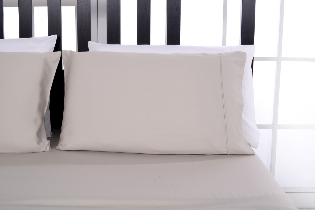 Bamboo sheet set on a made bed — lifestyle